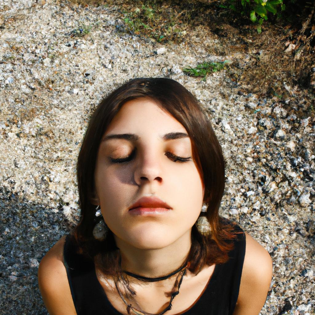 Person meditating with closed eyes